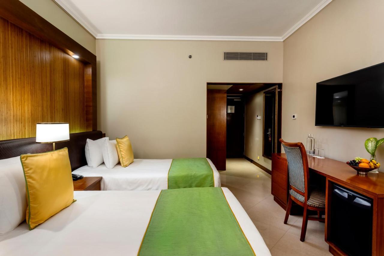 Caravela Beach Resort Varca Bagian luar foto A room at the hotel