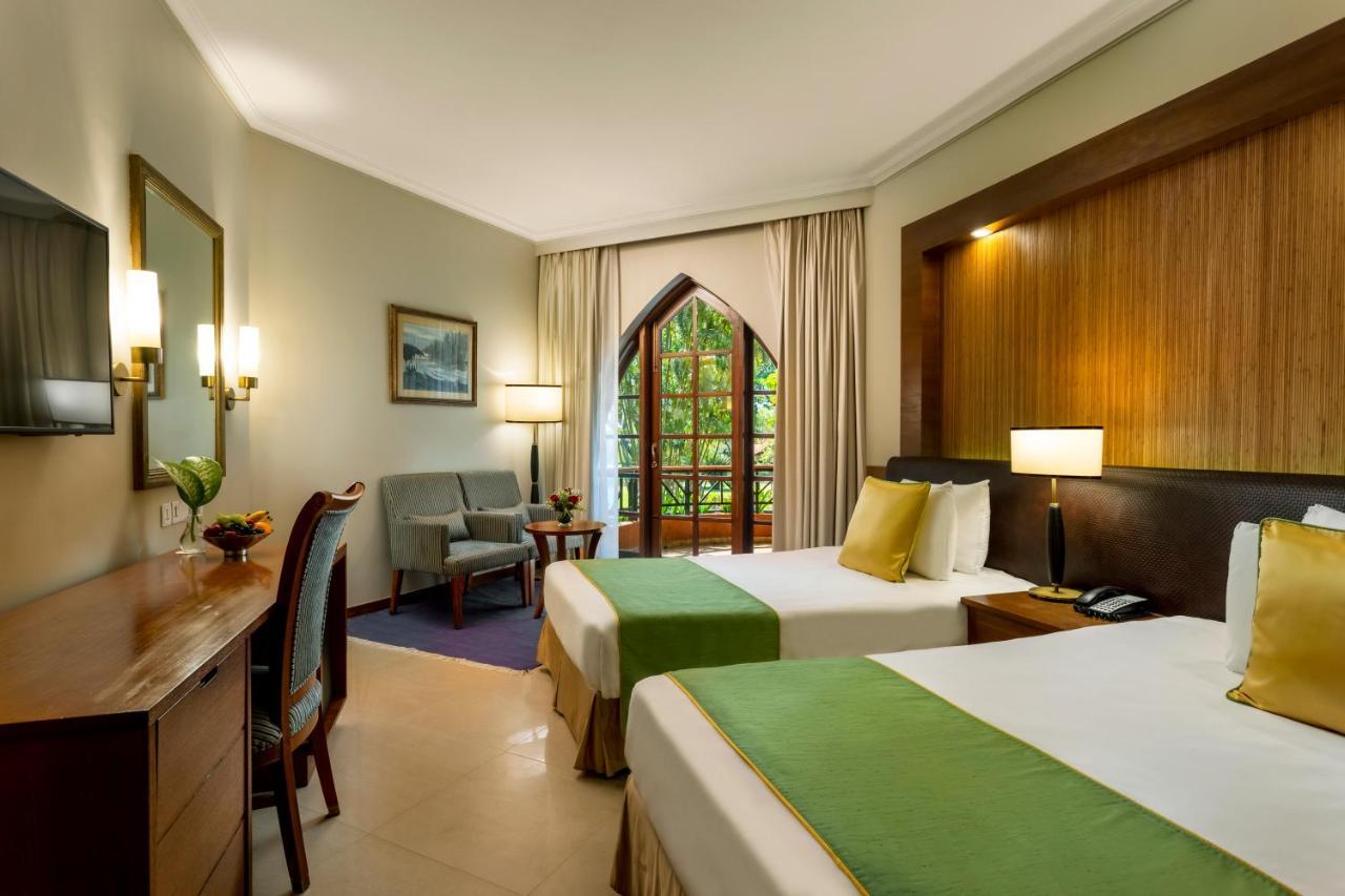 Caravela Beach Resort Varca Bagian luar foto A room at the hotel