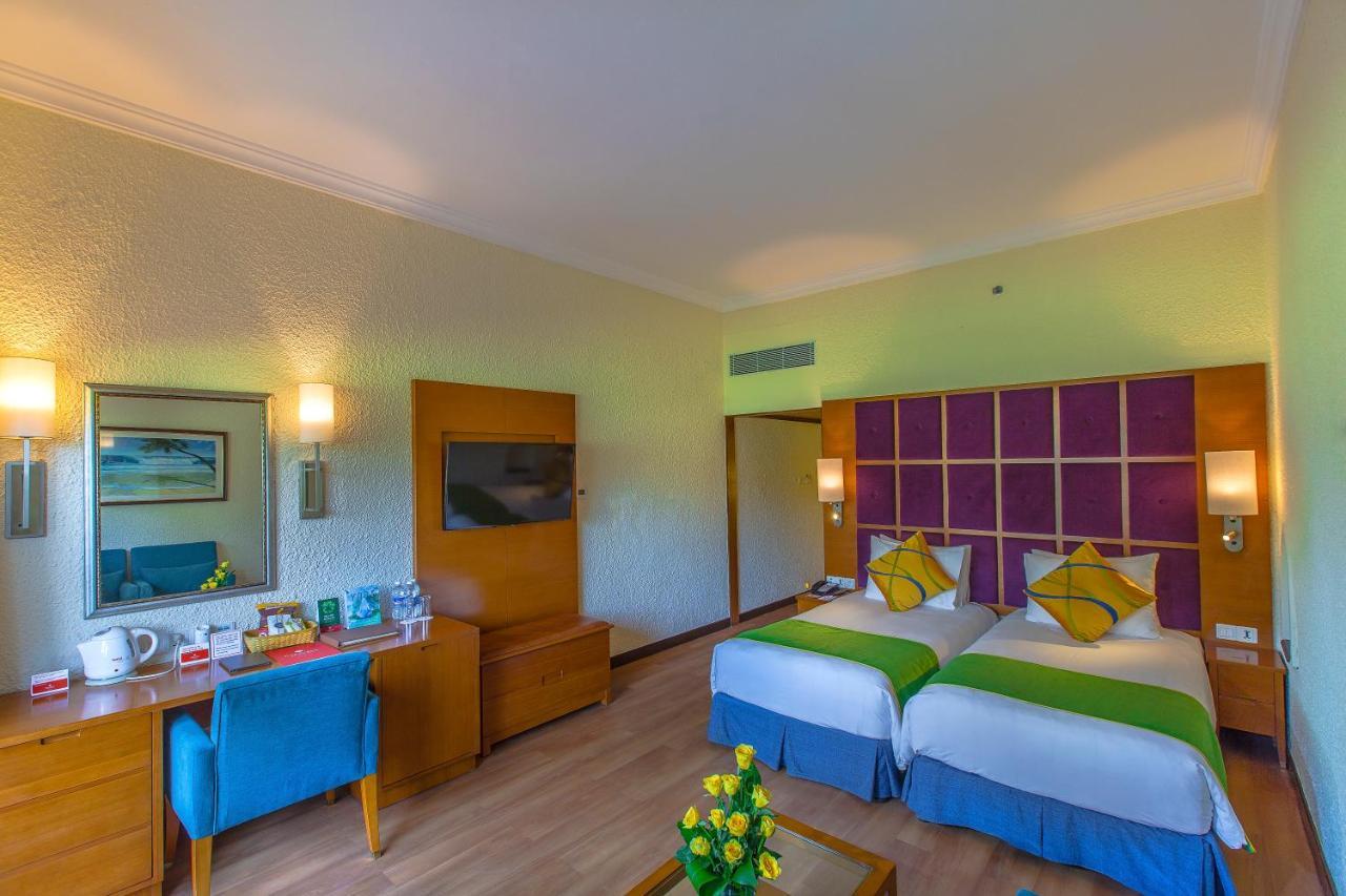 Caravela Beach Resort Varca Bagian luar foto A room at the hotel