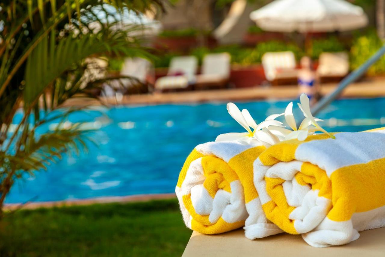 Caravela Beach Resort Varca Bagian luar foto Pool towels